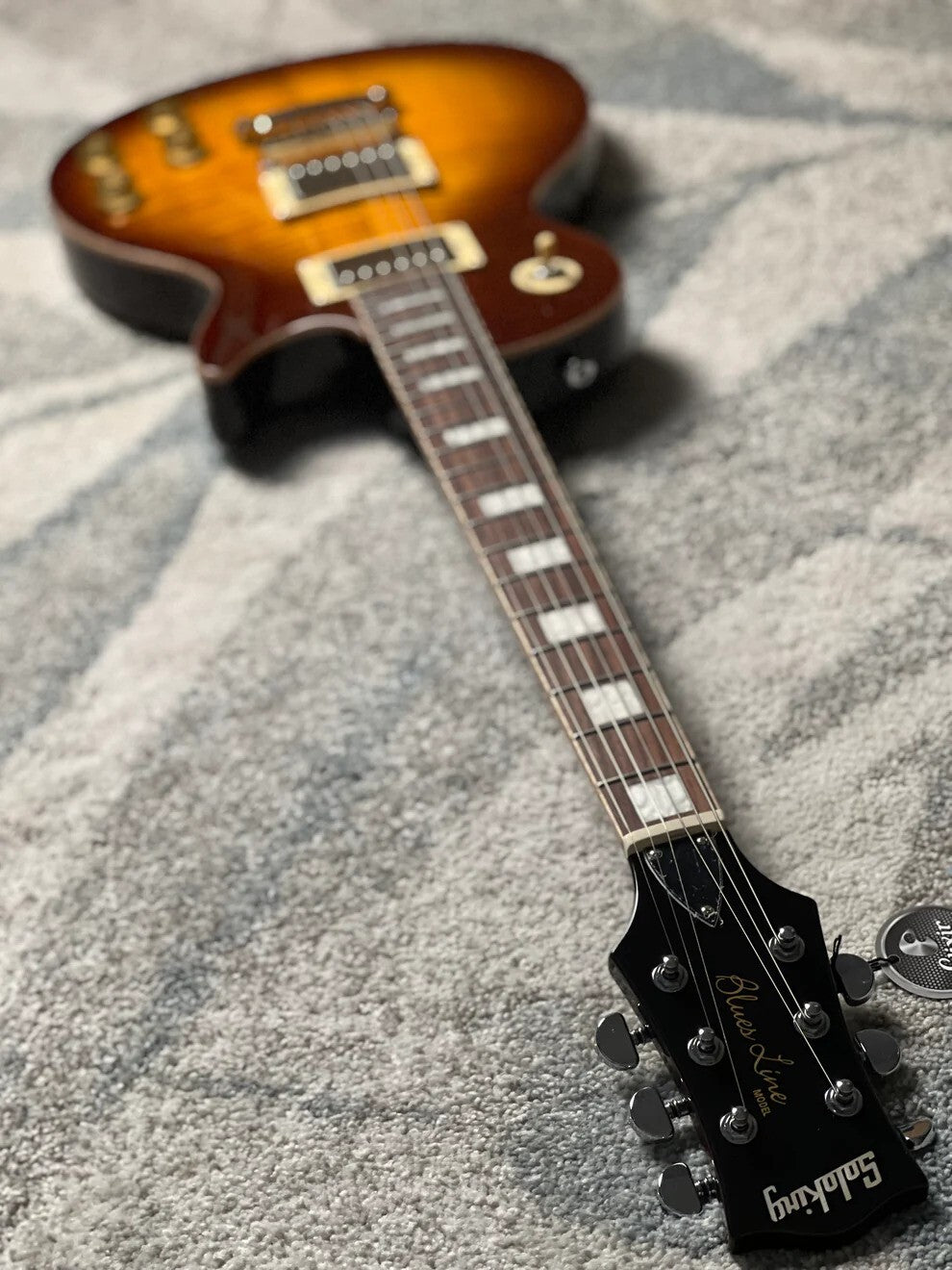 Soloking SLS50FM Deluxe with 5A Flame Top in Honeyburst